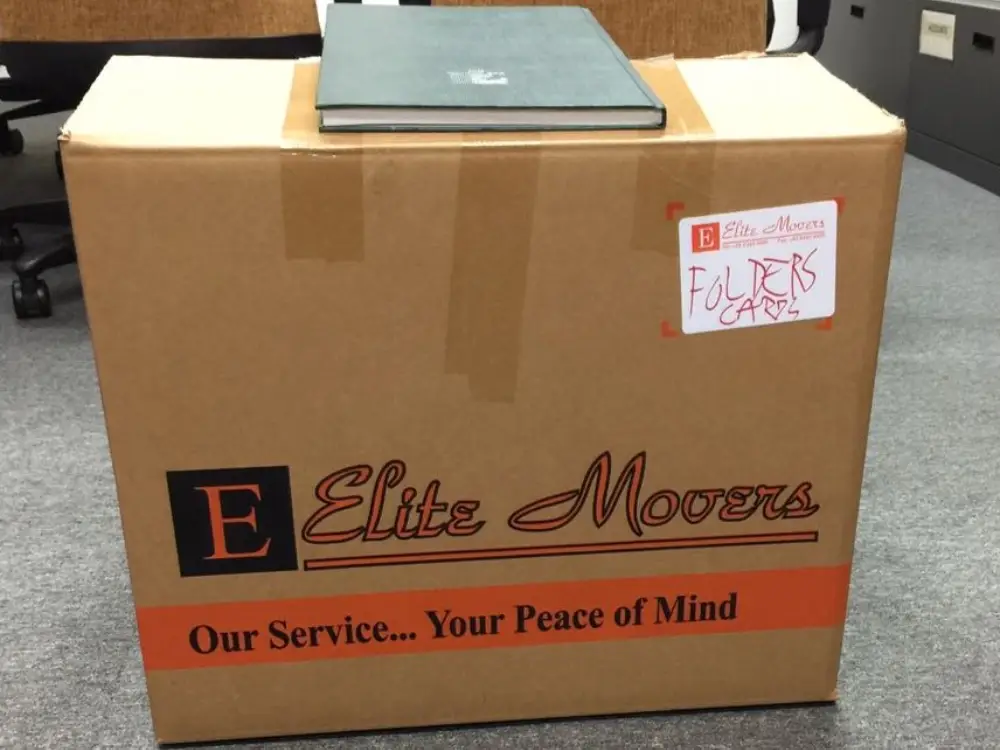 Moving carton box labelled as "folders cards"