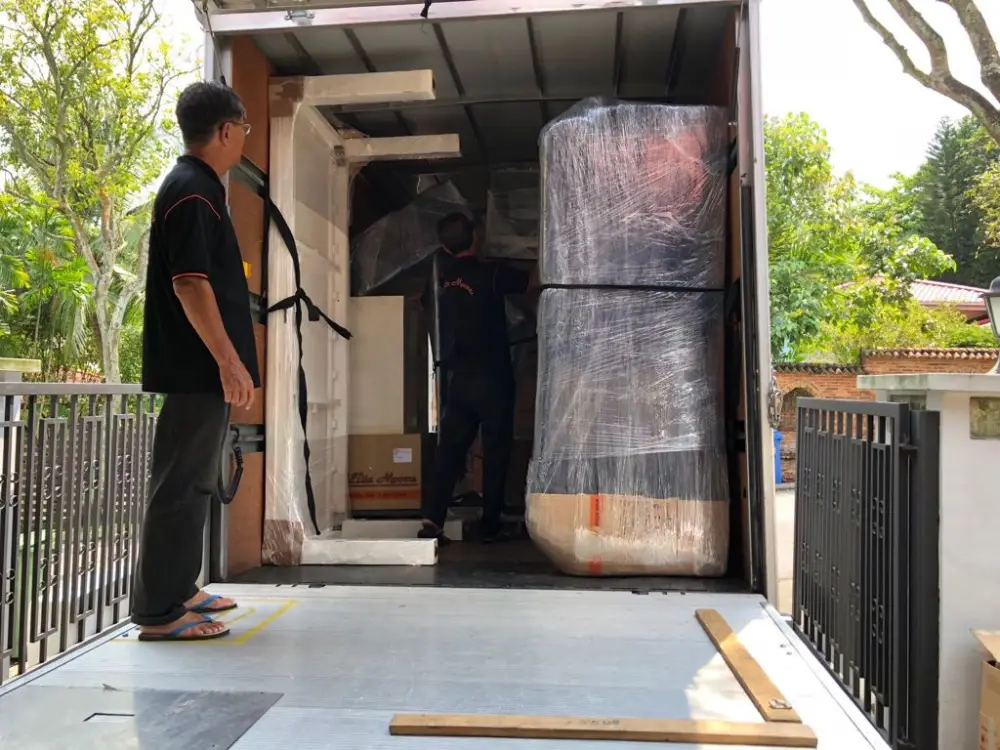 Loading up wrapped and protected items from customer's home onto the truck
