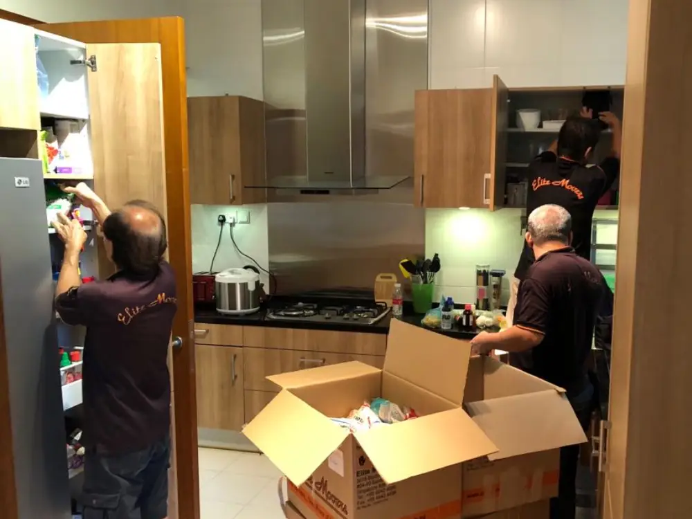 Elite Movers team unpacking the kitchen for customer