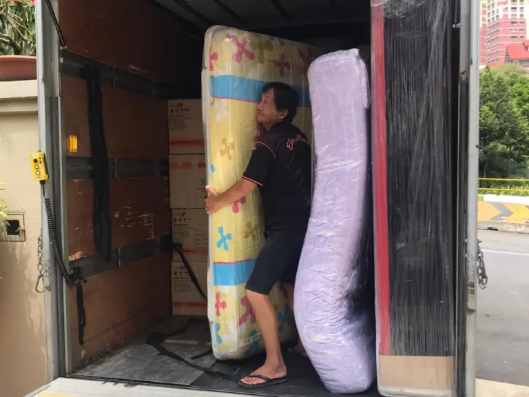 Moving wrapped and protected mattresses into customer's new home