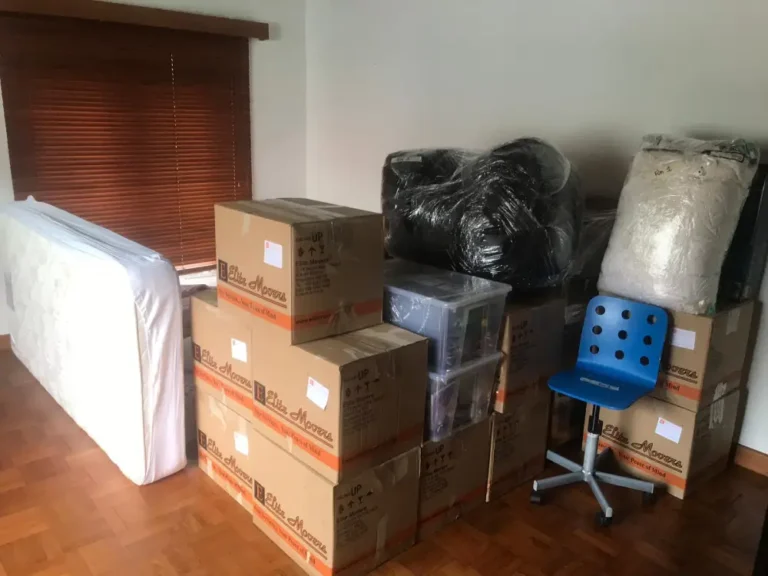 Elite Movers helping customer move into a new space with boxes for dedicated room