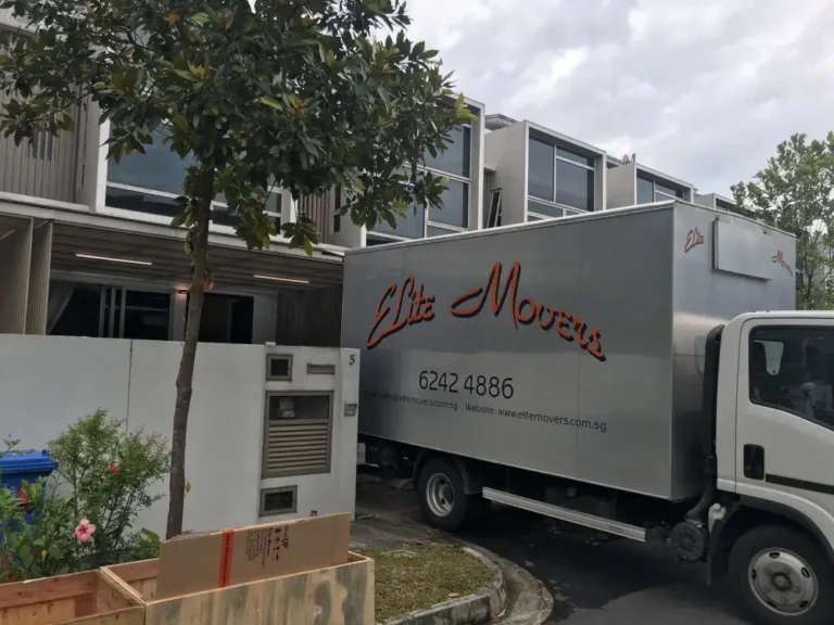 Elite Movers truck backing into customer's property