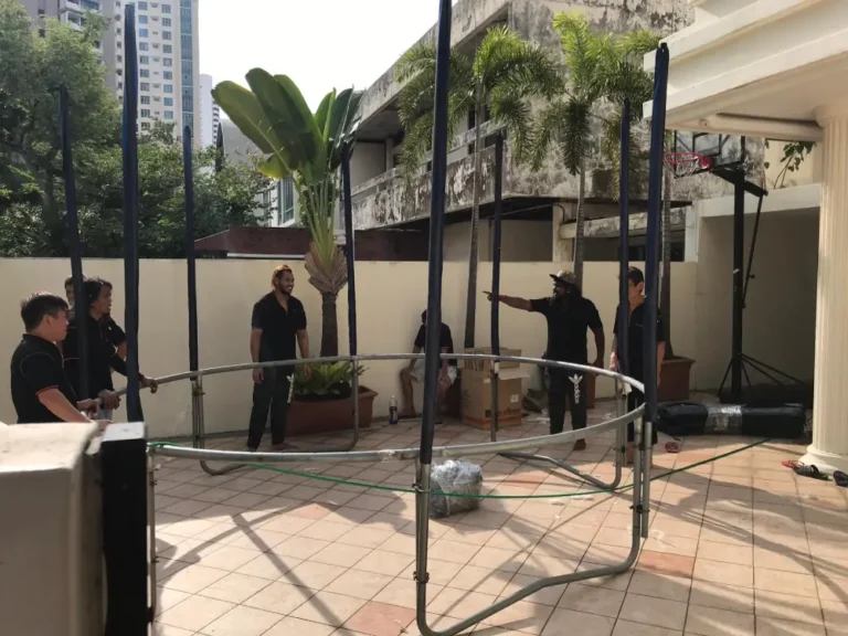 Elite Movers team working to move a trampoline